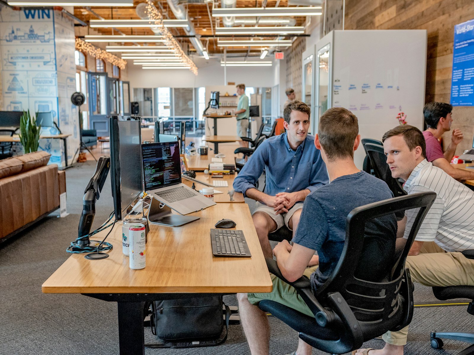 Colleagues reviewing product information on a laptop